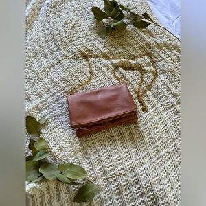 Mauve crossbody purse with gold chain and details